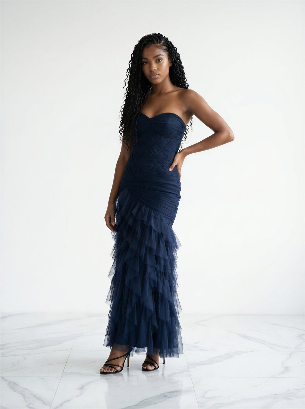 The delicate ruched tulle party and bridal dress